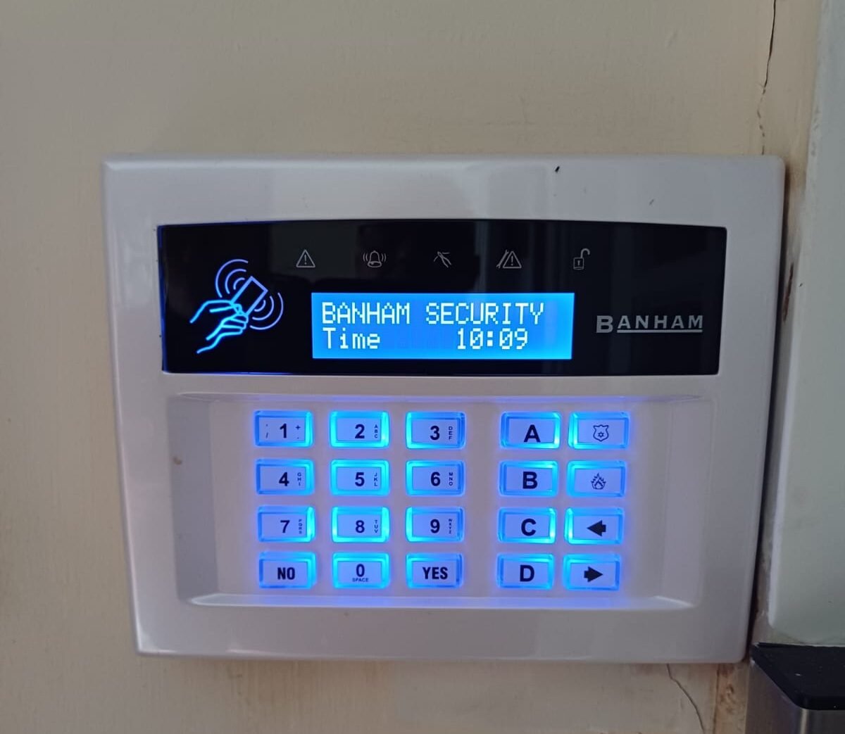 A Banham Security home alarm system keypad on a wall | HOME SECURITY INSTALLATIONS